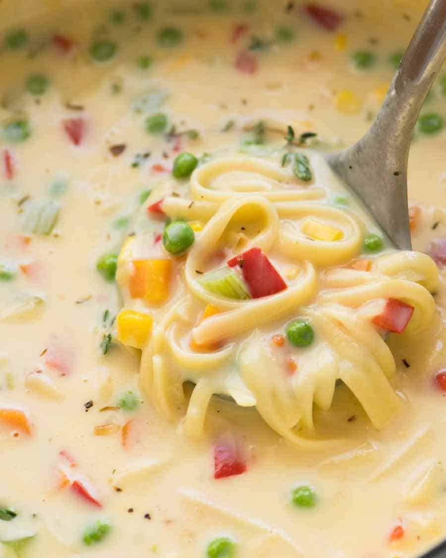 Close up of Cream of Vegetable Soup with Noodles (no cream!) in a pot, fresh off the stove ready to be served
