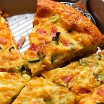 Close up of slice of crustless quiche